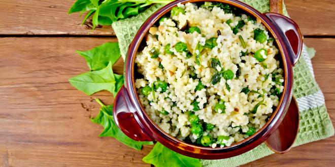 a bowl of couscous with peas